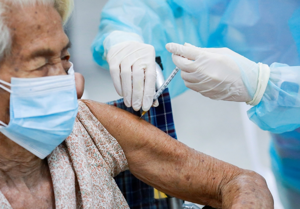 A woman gets vaccinated at the Central Vaccination Center in Bangkok, Thailand, July 26, 2021. Reuters/Soe Zeya Tun/File Photo