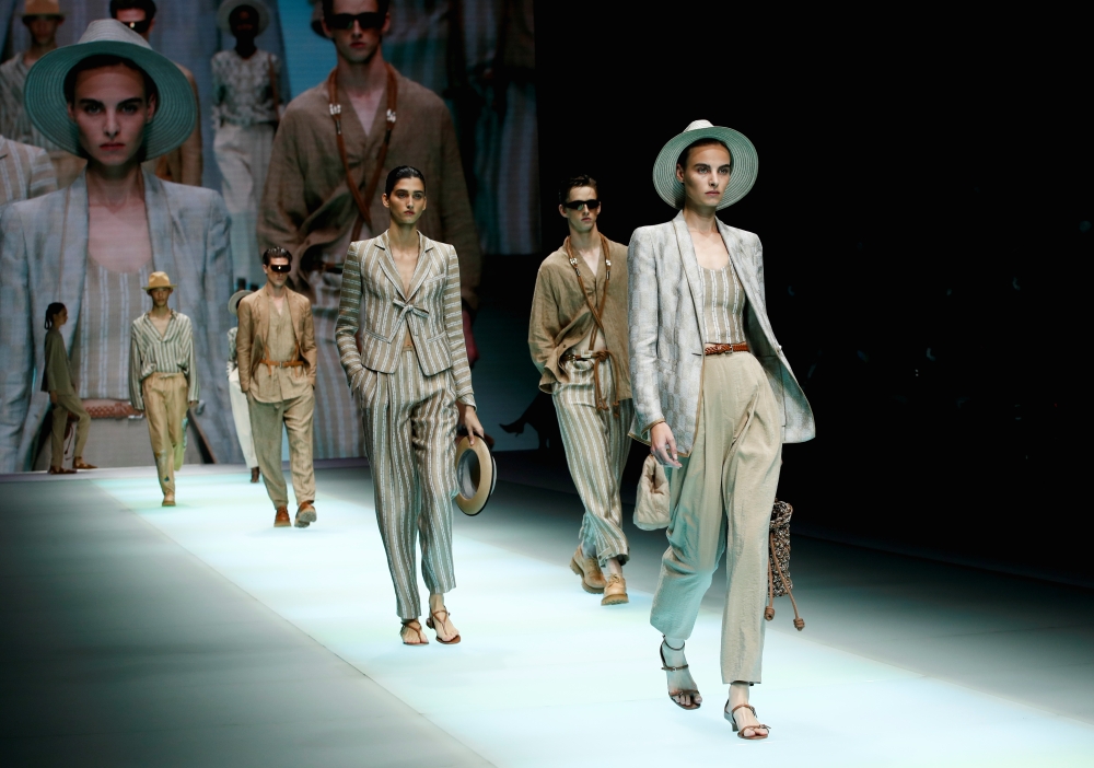 Models present creations from the Emporio Armani Spring/Summer 2022 collection during Milan Fashion Week in Milan, Italy, September 23, 2021. REUTERS/Alessandro Garofalo
