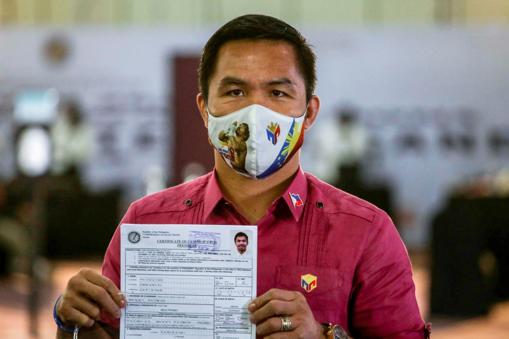 Philippine senator and newly retired boxing icon Manny Pacquiao files his certificate of candidacy to join the presidential race, at Sofitel Harbor Garden Tent, in Pasay City, Metro Manila, Philippines, October 1, 2021. Jam Sta Rosa/Pool via REUTERS