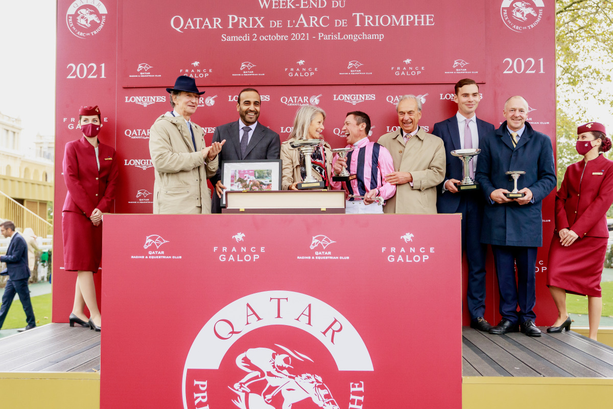 Qatar Racing and Equestrian Club's Chairman Issa bin Mohammed Al Mohannadi with the connection of Loving Dream after the Lordship stud-owned filly landed Qatar Prix De Royallieu Gr.1 on the opening day of the Qatar Prix de l’Arc de Triomphe weekend at Par