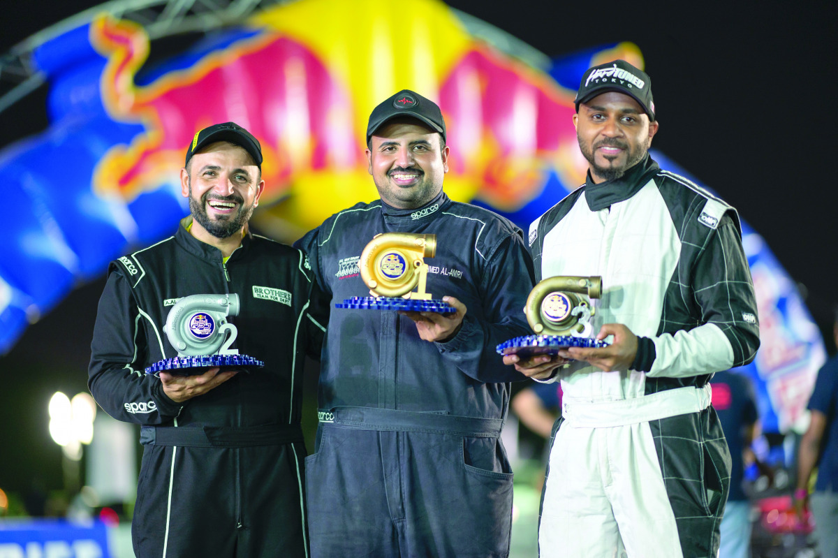 Ahmed Al Amri (centre) poses with other participants. 