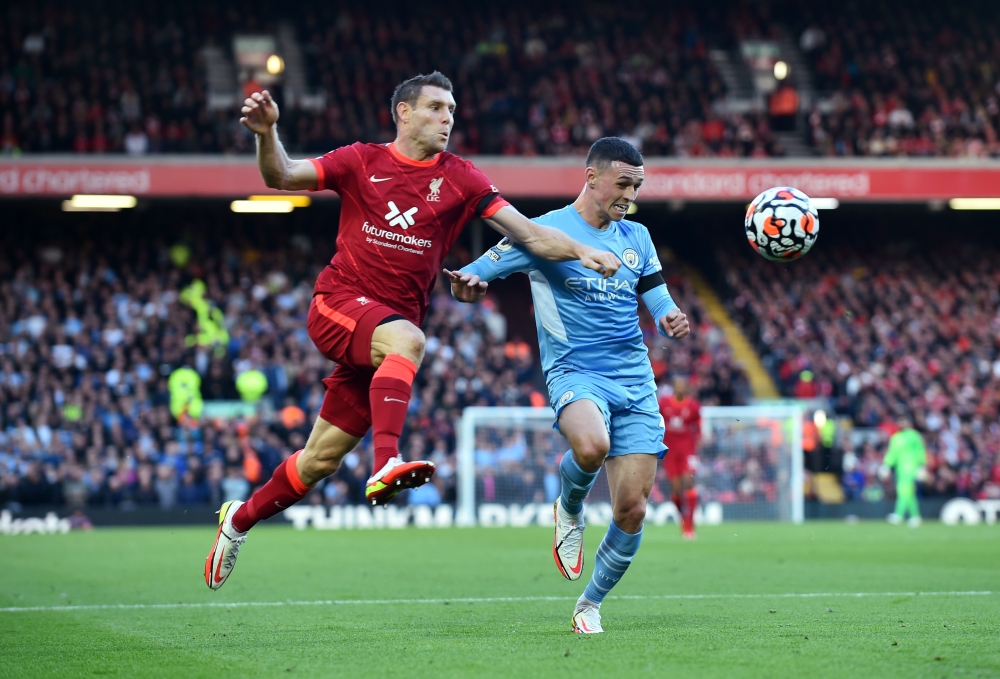Liverpool's James Milner in action with Manchester City's Phil Foden REUTERS/Peter Powell 