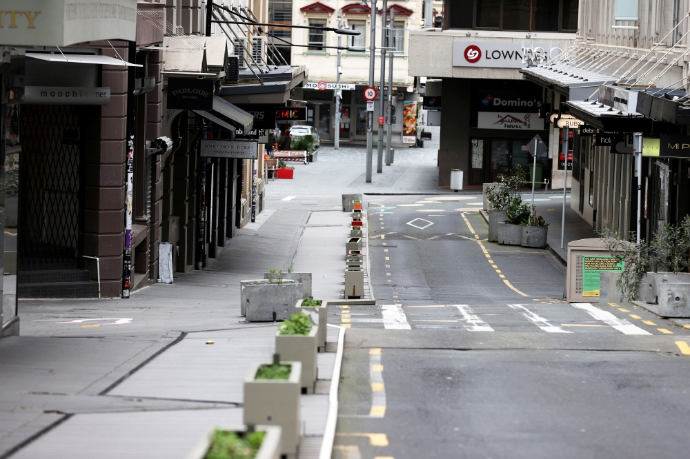 New Zealand will phase out a COVID-19 lockdown in Auckland that led to a largely deserted city when enacted in August. Picture taken August 26, 2021. REUTERS/Fiona Goodall/File Photo
