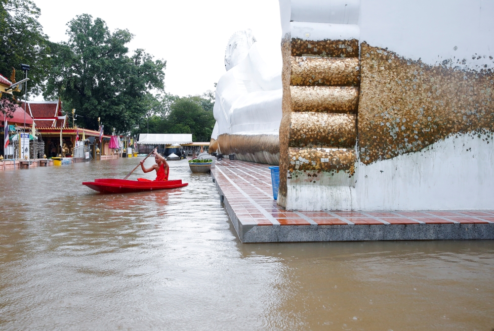 A lying Buddha statue is seen during the flood at a temple in Ayutthaya, Thailand, October 6, 2021. REUTERS/Soe Zeya Tun
