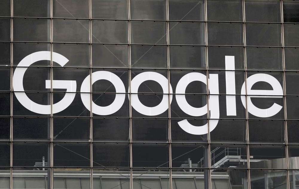 The logo of Google is seen on a building at La Defense business and financial district in Courbevoie near Paris, France, September 1, 2020. REUTERS/Charles Platiau/File Photo