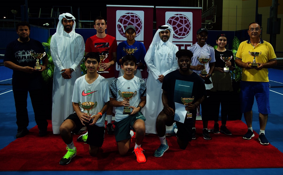 Winners of the Al Majed Open Tournament with QTSBF Secretary General Tareq Zainal and Al Majed Group’s Director of Business development Nasser Ahmed Al Majed.