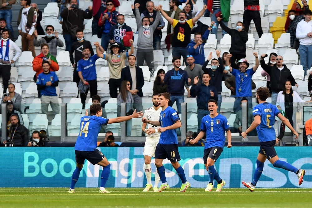 Italy's Nicolo Barella celebrates scoring their first goal with Federico Chiesa REUTERS/Massimo Pinca