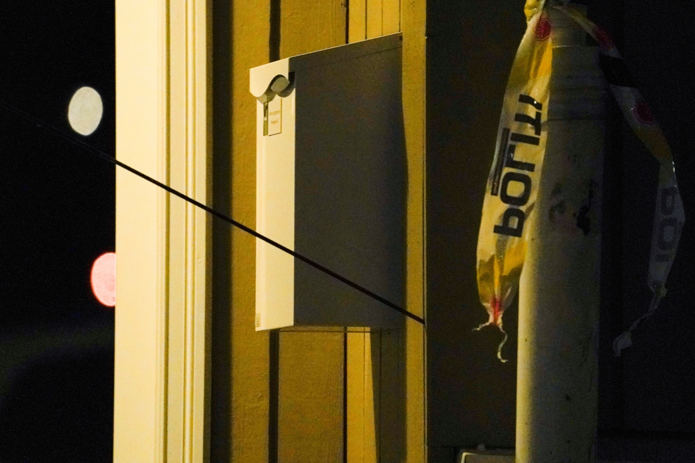 An arrow left in a wall is seen after several people were killed and others were injured by a man using a bow and arrows to carry out attacks, in Kongsberg, Norway, October 13, 2021. Terje Bendiksby/NTB/via REUTERS