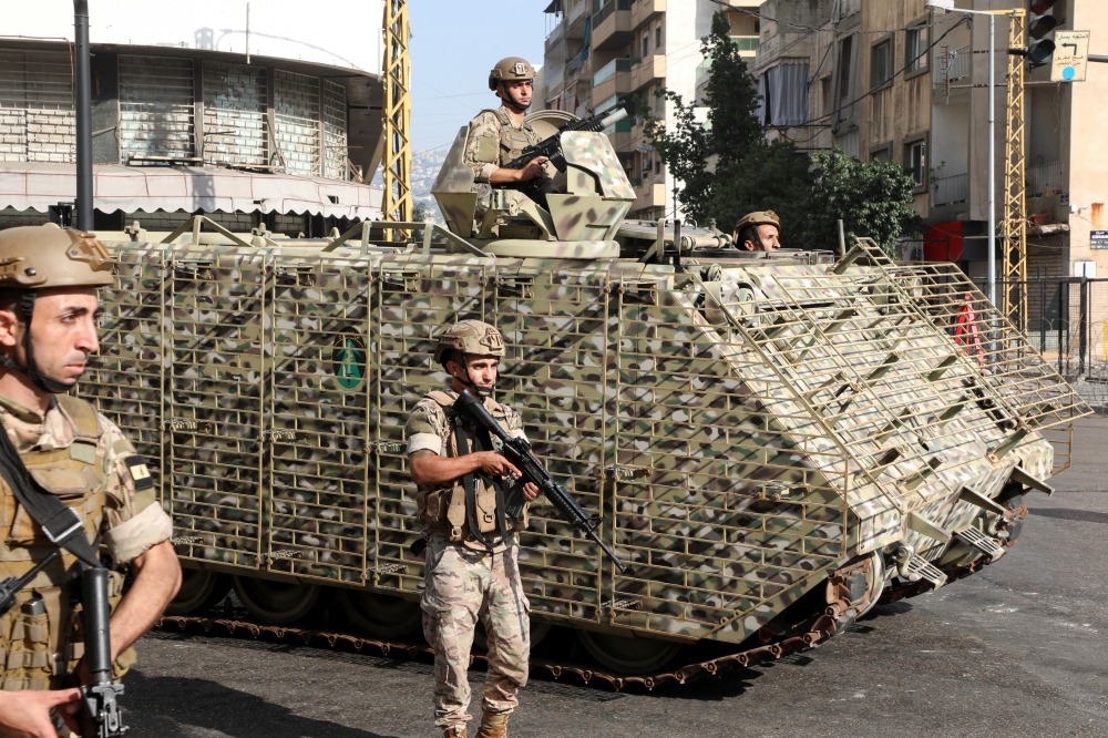 Army soldiers patrol after gunfire erupted, in Beirut, Lebanon October 14, 2021. REUTERS/Mohamed Azakir
