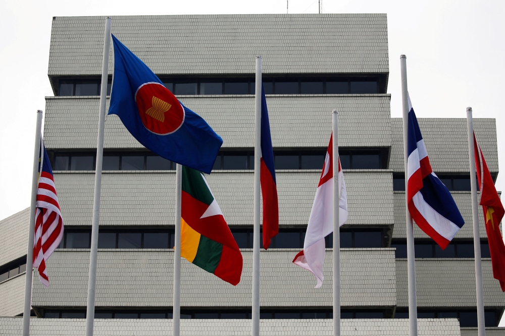 Flags are seen outside the Association of Southeast Asian Nations (ASEAN) secretariat building, ahead of the ASEAN leaders' meeting in Jakarta, Indonesia, April 23, 2021. Reuters/Willy Kurniawan//File Photo