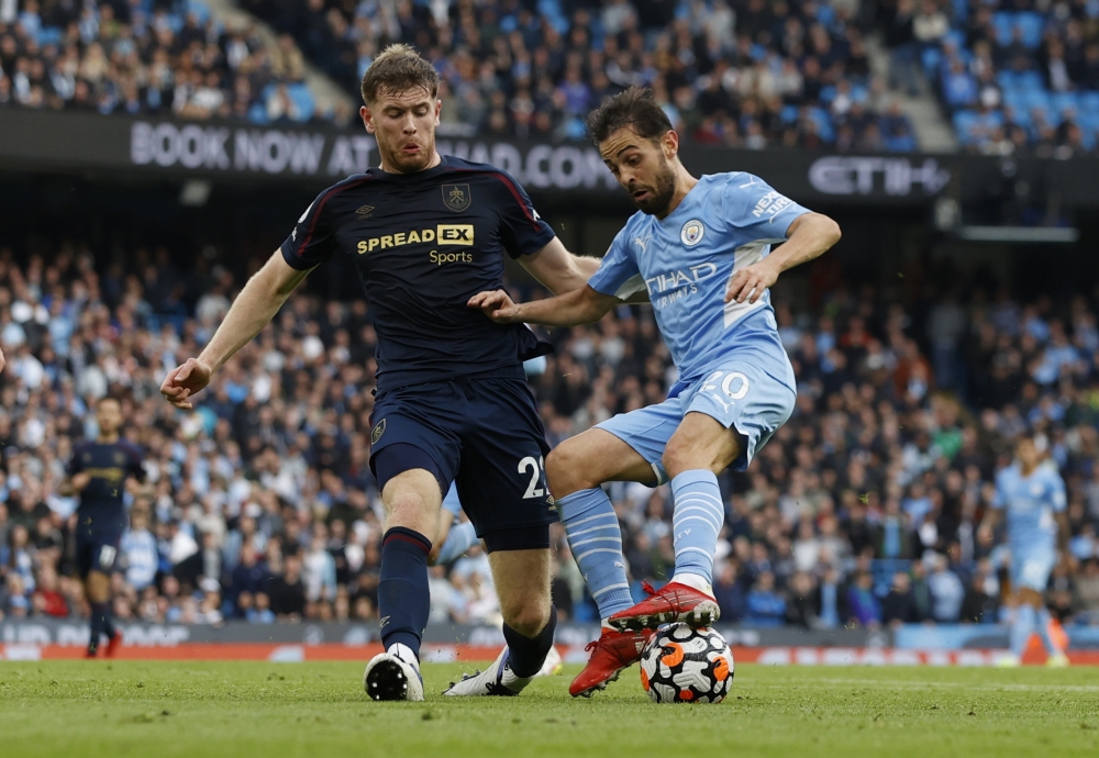 Manchester City's Bernardo Silva in action with Burnley's Nathan Collins (REUTERS/Phil Noble)