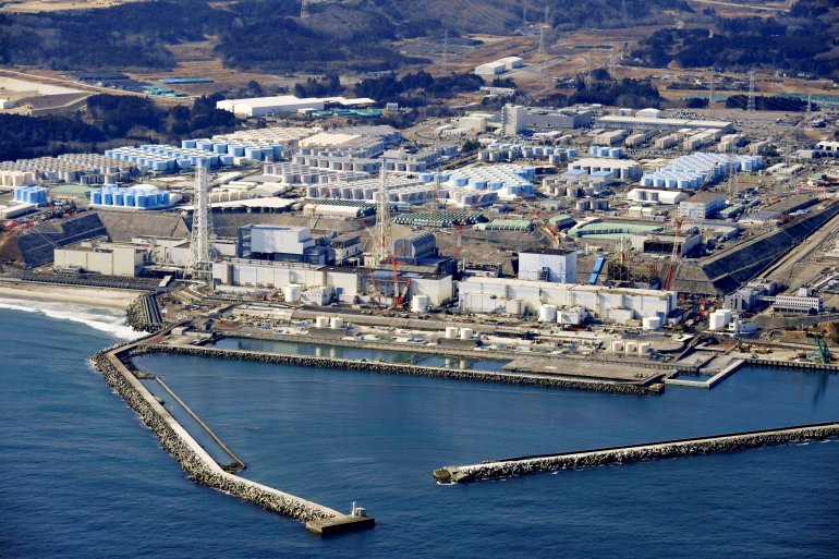 FILE PHOTO: An aerial view shows the storage tanks for treated water at the tsunami-crippled Fukushima Daiichi nuclear power plant in Okuma town, Fukushima prefecture, Japan February 13, 2021, in this photo taken by Kyodo. Picture taken February 13, 2021.