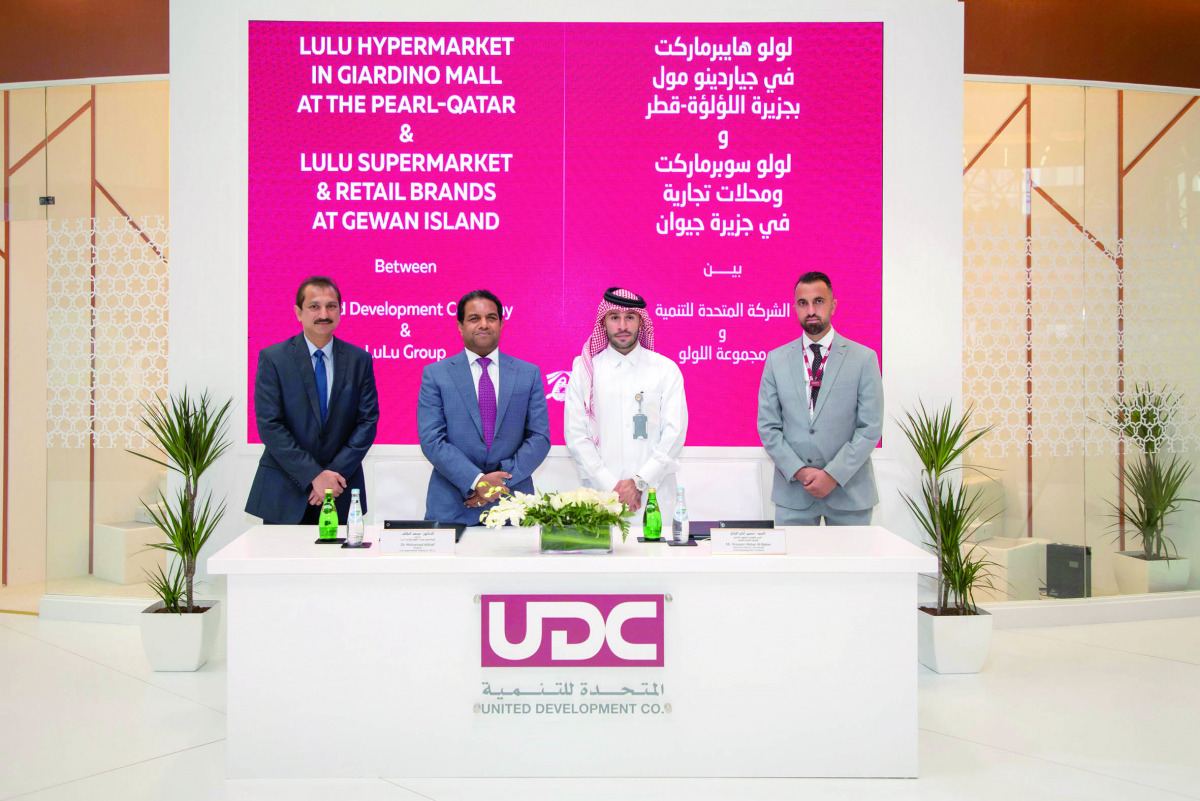 Executive Director Commercial at UDC Hussain Akbar Al Baker, Director of Lulu Group International Dr. Mohamed Althaf with other officials, during the signing ceremony on the sidelines of Cityscape Qatar 2021, yesterday. 