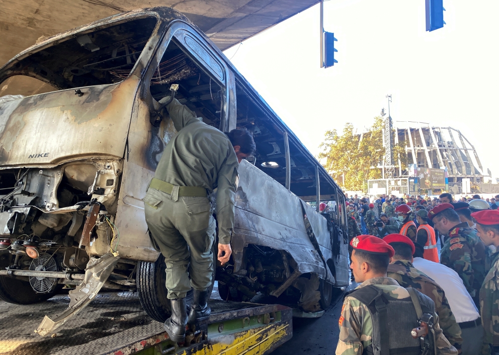 Military police inspect the site of an explosion in central Damascus, Syria October 20, 2021. REUTERS/Firas Makdesi
 