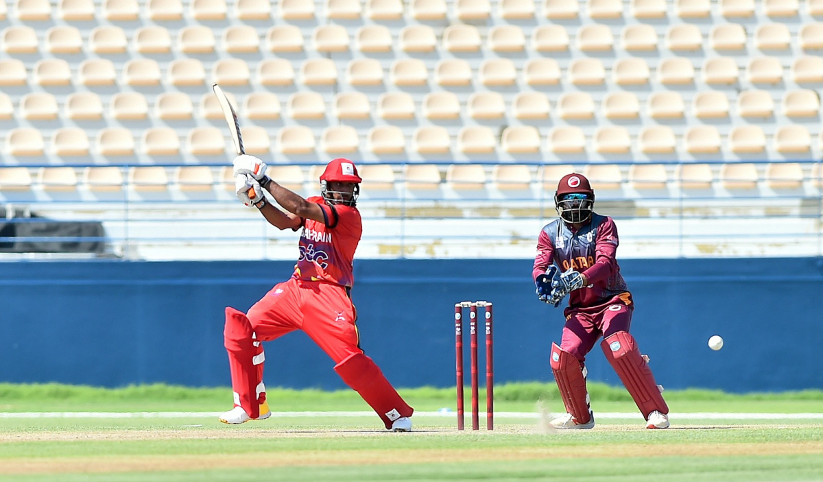 Bahrain's Muhammad Younis plays a shot as Qatar's wicketkeeper Mohammed Rizlan looks on. Pictures: Abdul Basit / The Peninsula 