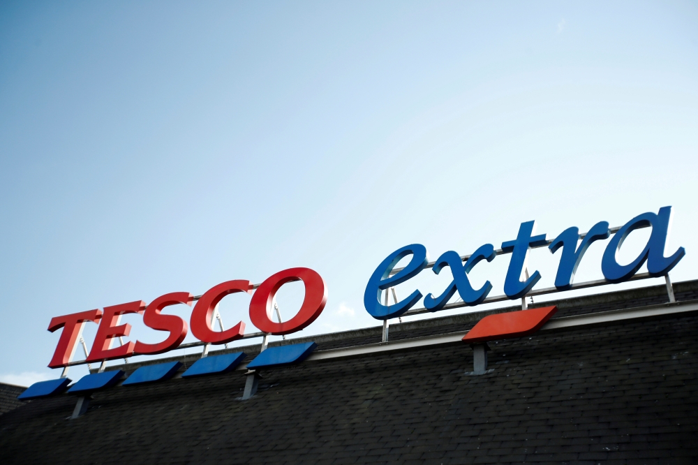 A logo of Tesco is pictured outside a Tesco supermarket in Hatfield, Britain October 6, 2020. REUTERS/Peter Cziborra/File Photo
