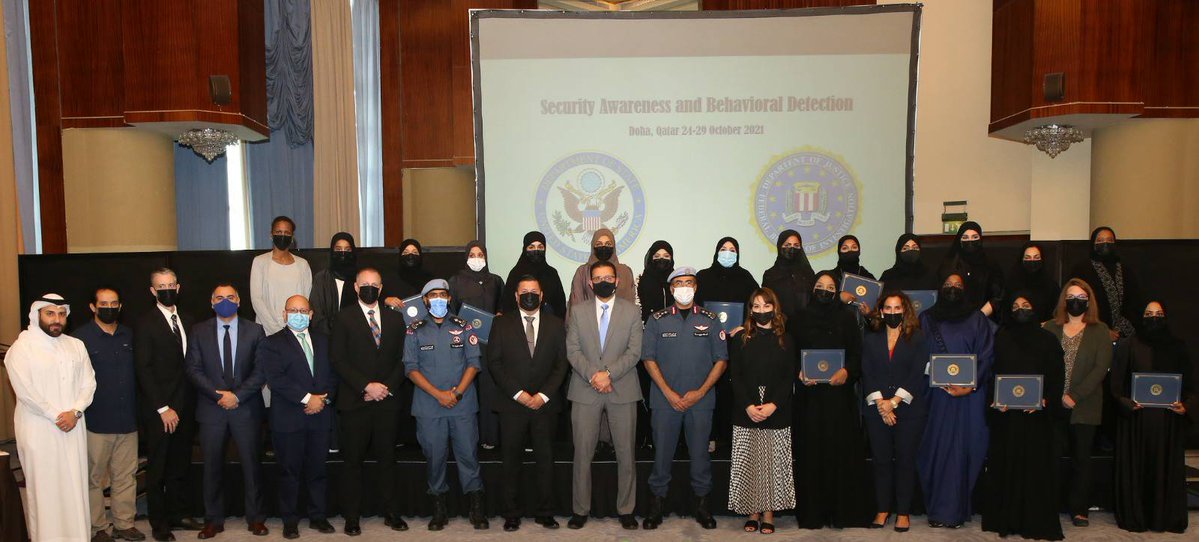 Officials and participants of the security awareness course pose for a photograph.