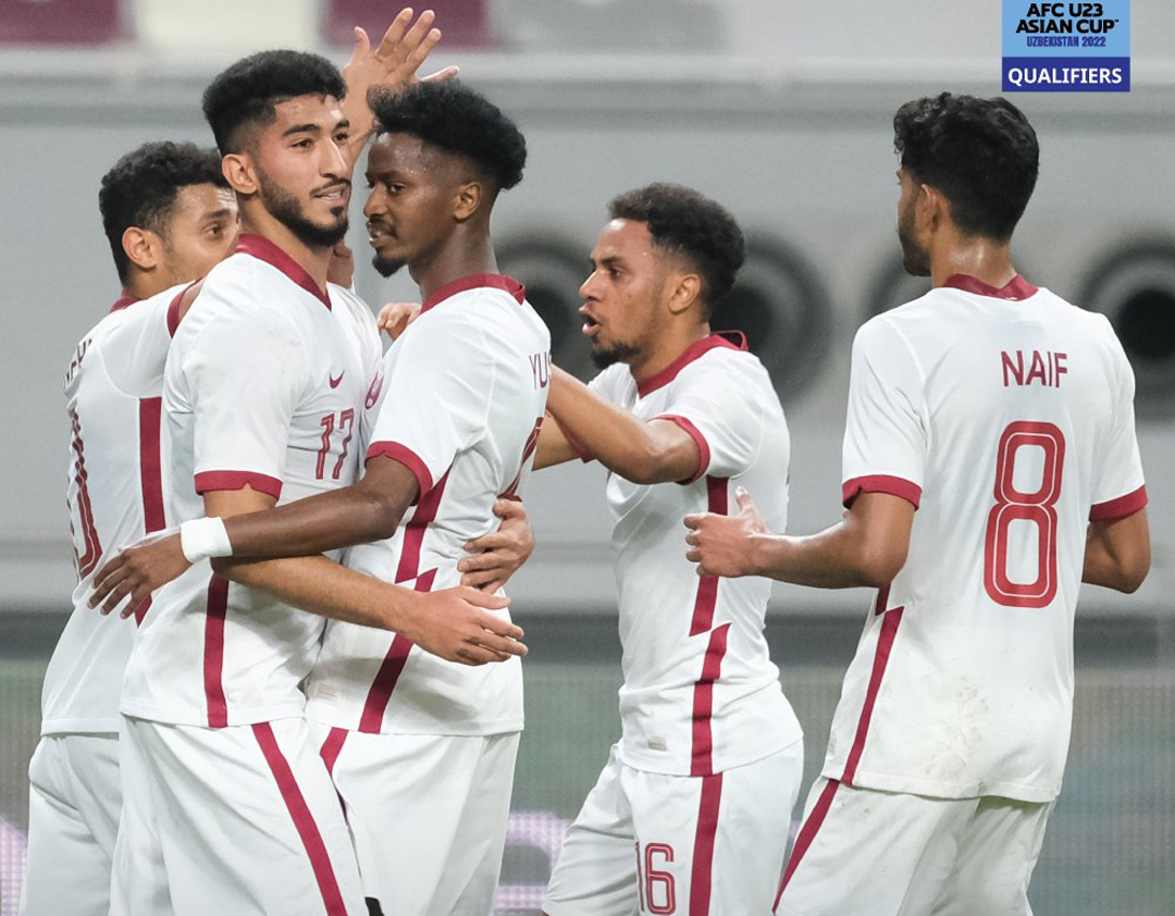 Qatar U-23 players celebrate after drawing their last AFC U23 Asian Cup Uzbekistan 2022 Group qualifier against Syria, yesterday. Unbeaten Qatar topped Group A to qualify for next year's tournament.