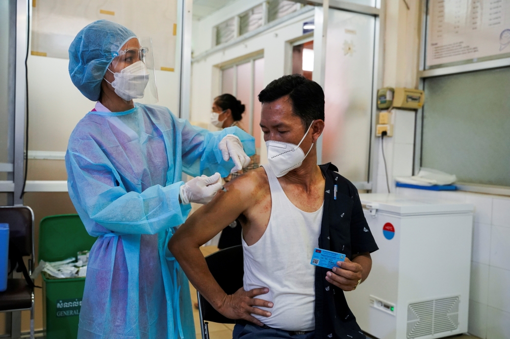 A man receives the AstraZeneca coronavirus disease (COVID-19) vaccine as a booster dose at the National Pediatric Hospital in Phnom Penh, Cambodia, August 12, 2021. REUTERS/Cindy Liu/File Photo