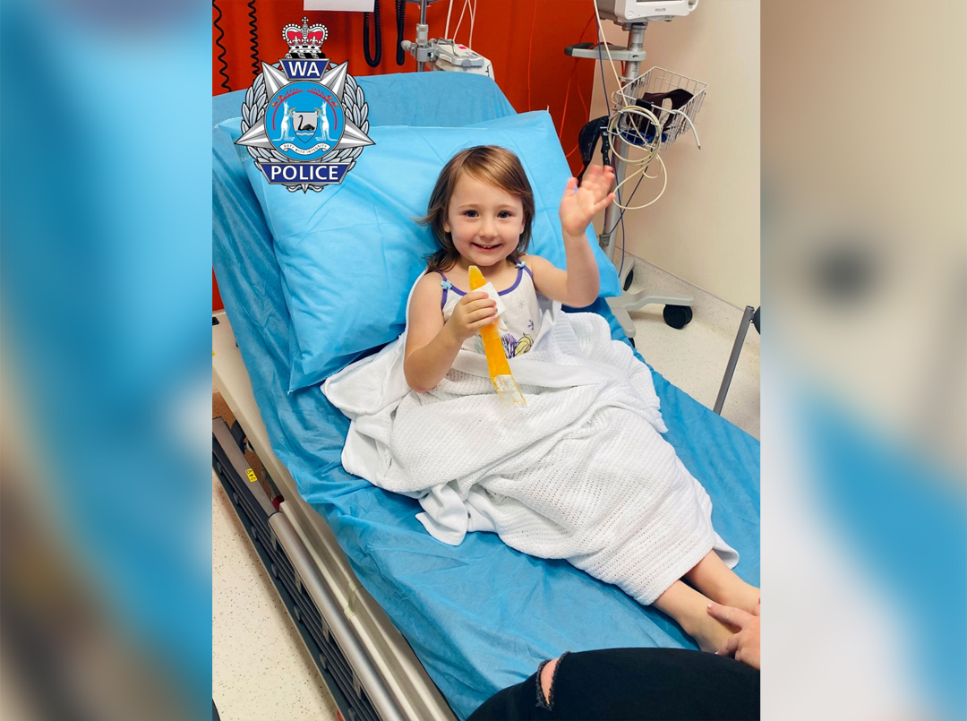 Cleo Smith, 4, who went missing from an Australian outback campsite more than two weeks ago and was found in a locked house on November 3, smiles from a hospital bed in Carnarvon, Australia, in this handout photo released to Reuters on November 3, 2021. Mandatory credit WESTERN AUSTRALIA POLICE FORCE/Handout via REUTERS