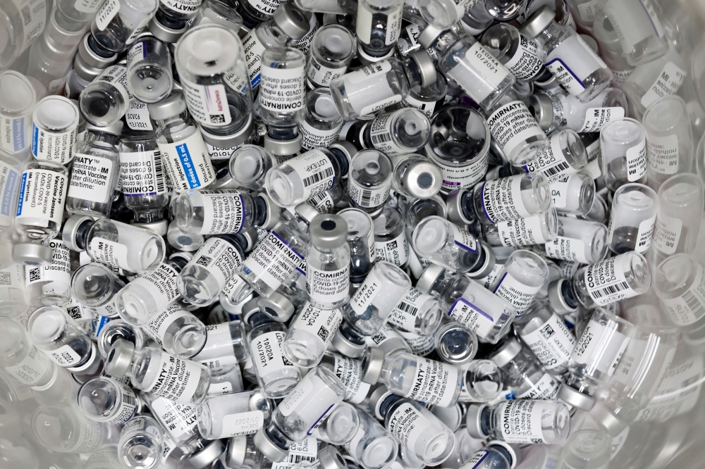 Empty vials of coronavirus disease (COVID-19) vaccines are pictured in a doctor's office in Berlin, Germany, November 2, 2021. Reuters/Hannibal Hanschke