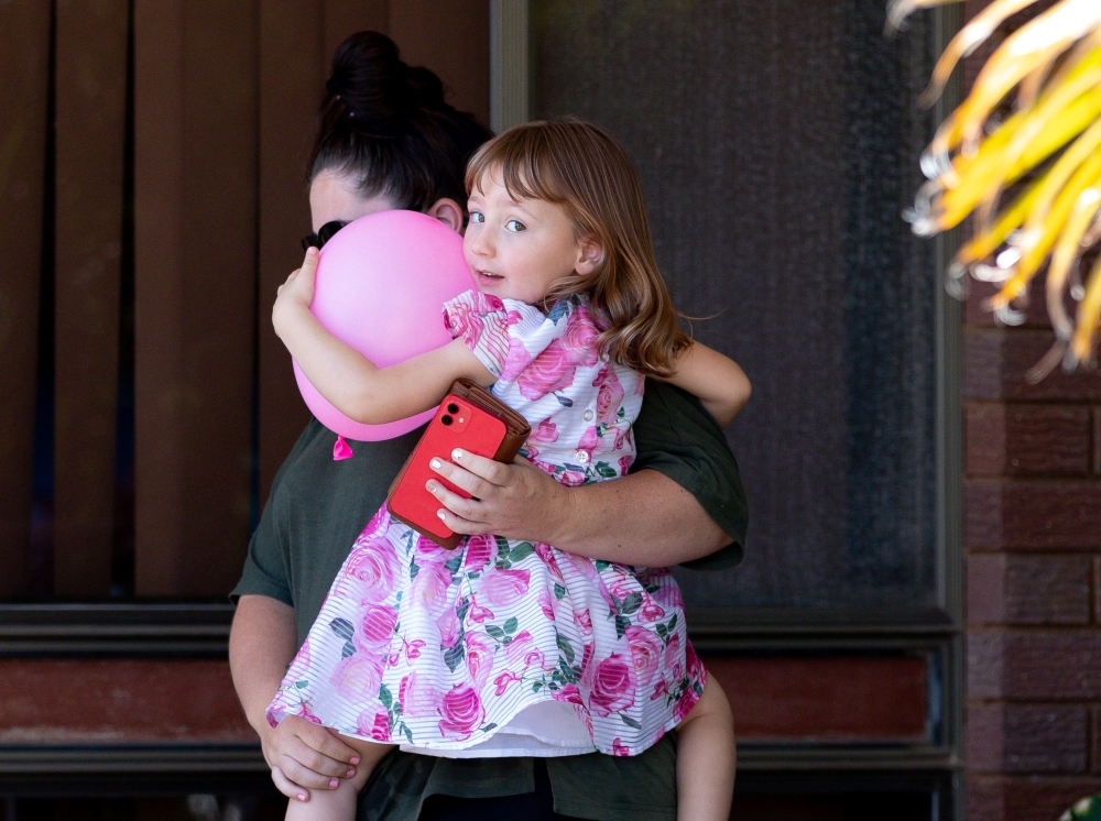 Cleo Smith and her mother Ellie Smith leave a house where the girl spent her first night after being rescued in Carnarvon, Australia, November 4, 2021. AAP/Richard Wainwright via REUTERS