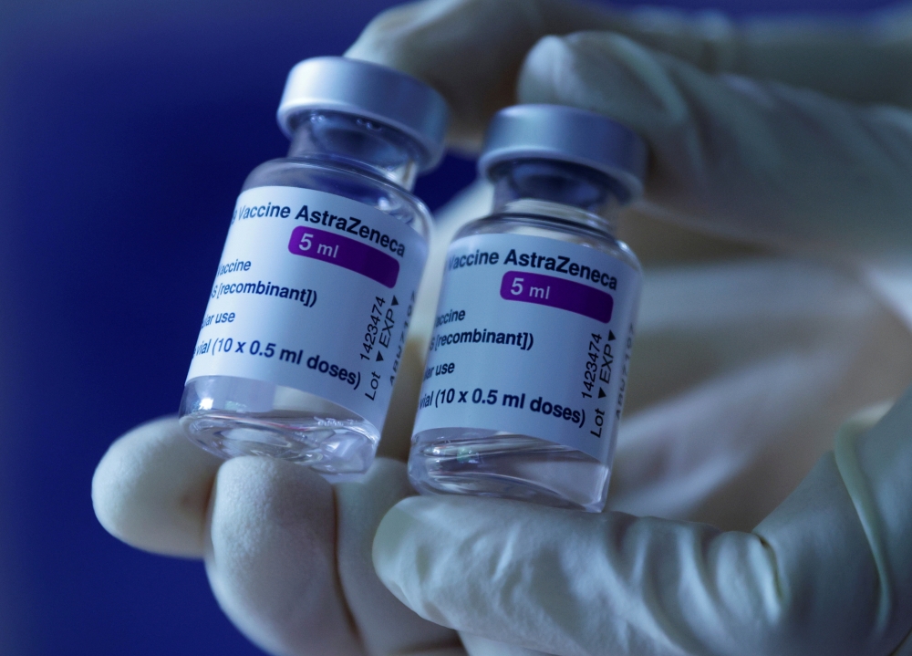 A doctor shows vials of AstraZeneca's COVID-19 vaccine in his general practice facility, as the spread of the coronavirus disease (COVID-19) continues, in Vienna, Austria May13, 2021. REUTERS/Leonhard Foeger/File Photo