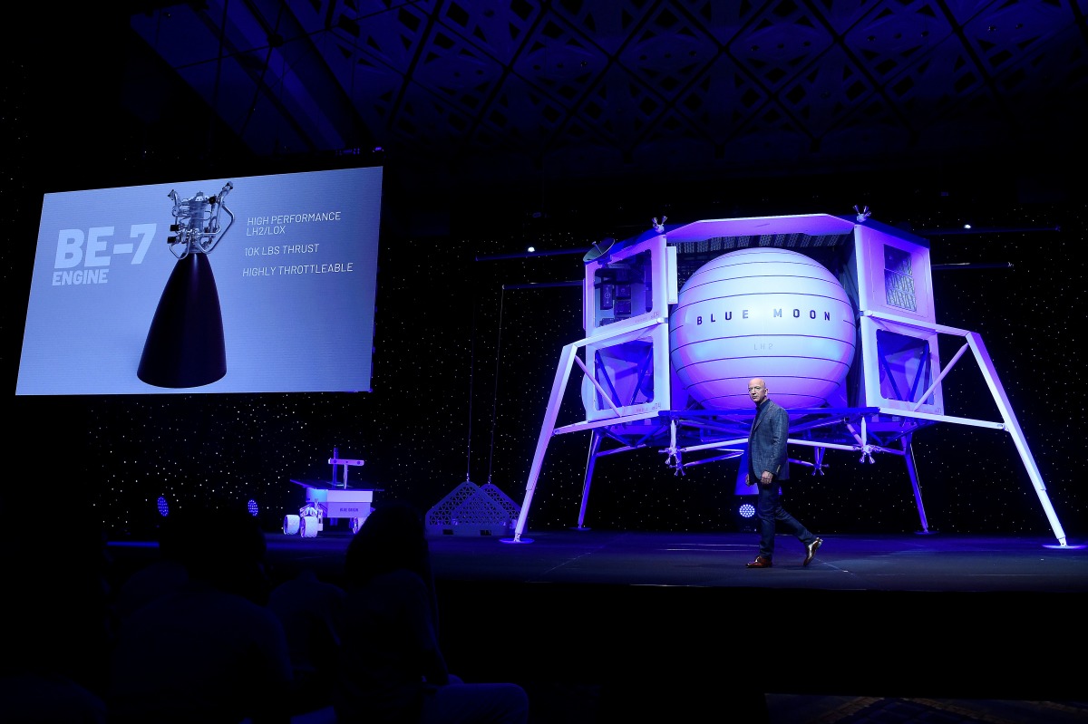 FILE PHOTO: Founder, Chairman, CEO and President of Amazon Jeff Bezos unveils the BE-7 rocket engine that his space company Blue Origin's space exploration lunar lander rocket called Blue Moon will use during an unveiling event in Washington, U.S., May 9, 2019. REUTERS/Clodagh Kilcoyne/File Photo
