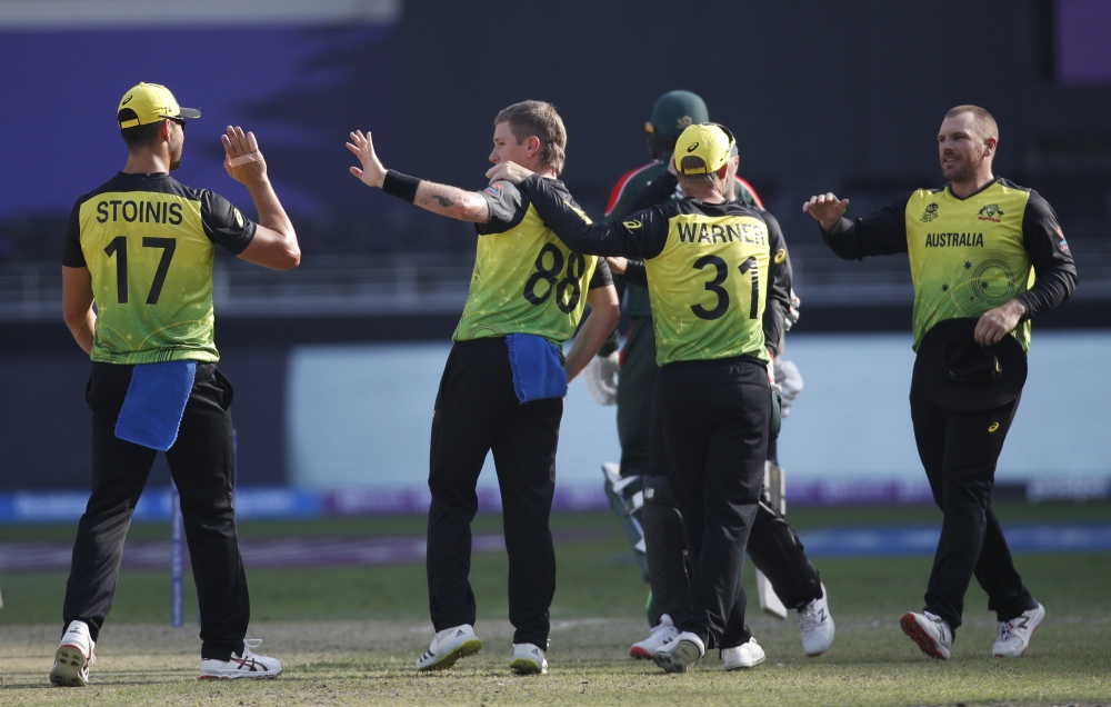 Australia players celebrate a wicket Reuters/Hamad I Mohammed