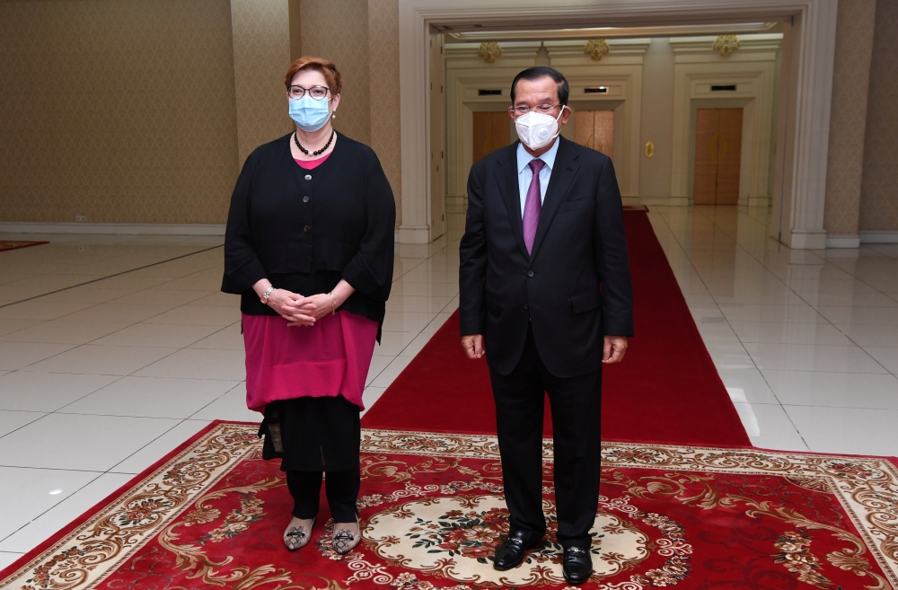 Australian Foreign Affairs Minister Marise Payne and Cambodia's Prime Minister Hun Sen pose for a photograph before their meeting at Peace Palace in Phnom Penh, Cambodia November 8, 2021. TVK/An Khoun SamAun/Handout via REUTERS