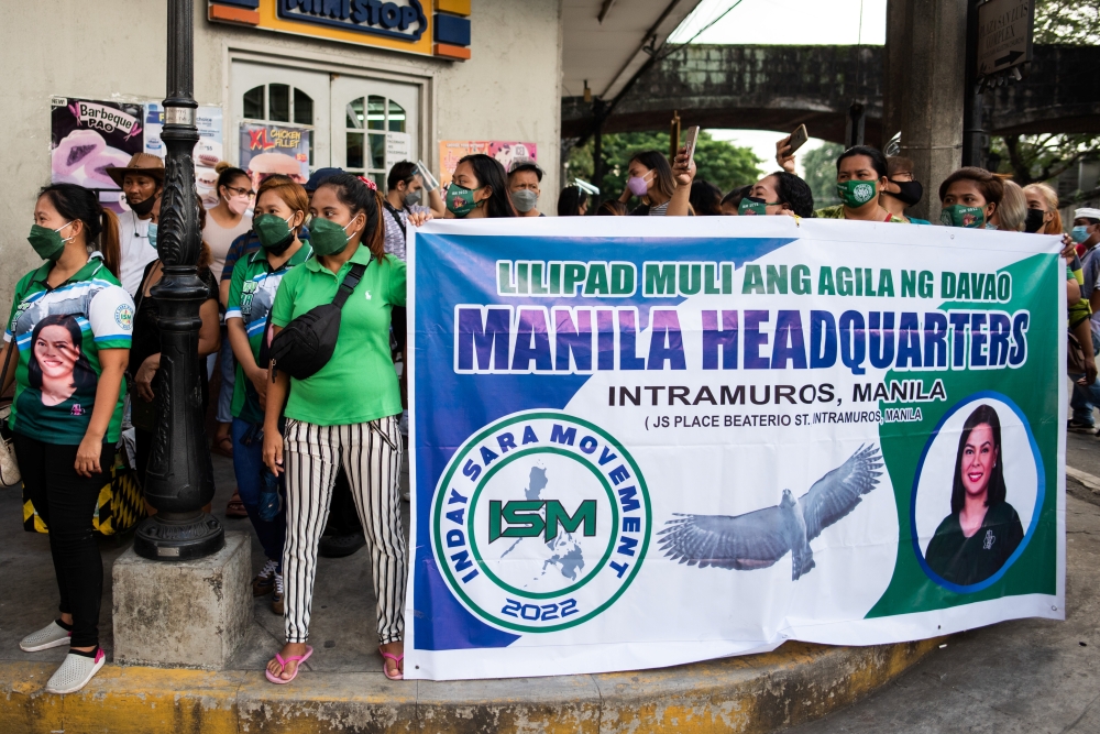 Supporters of Davao City Mayor Sara Duterte gather outside the Commission on Elections, after representatives filed her certificate of candidacy for vice president for the 2022 national election, in Manila, Philippines, November 13, 2021. Reuters/Lisa Marie David