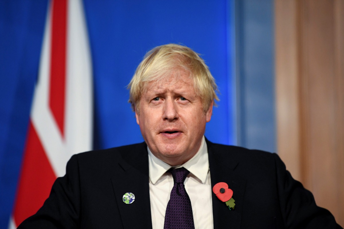 Britain's Prime Minister Boris Johnson speaks during a news conference following the the UN Climate Change Conference (COP26) inside the Downing Street Briefing Room in central London, Britain November 14, 2021. Daniel Leal/Pool via REUTERS
