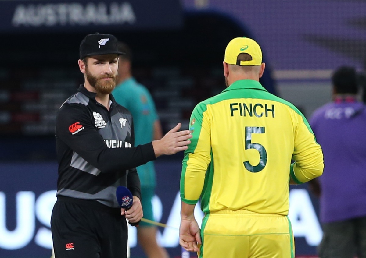 New Zealand captain Kane Williamson with Australia captain Aaron Finch before the match REUTERS/Satish Kumar
