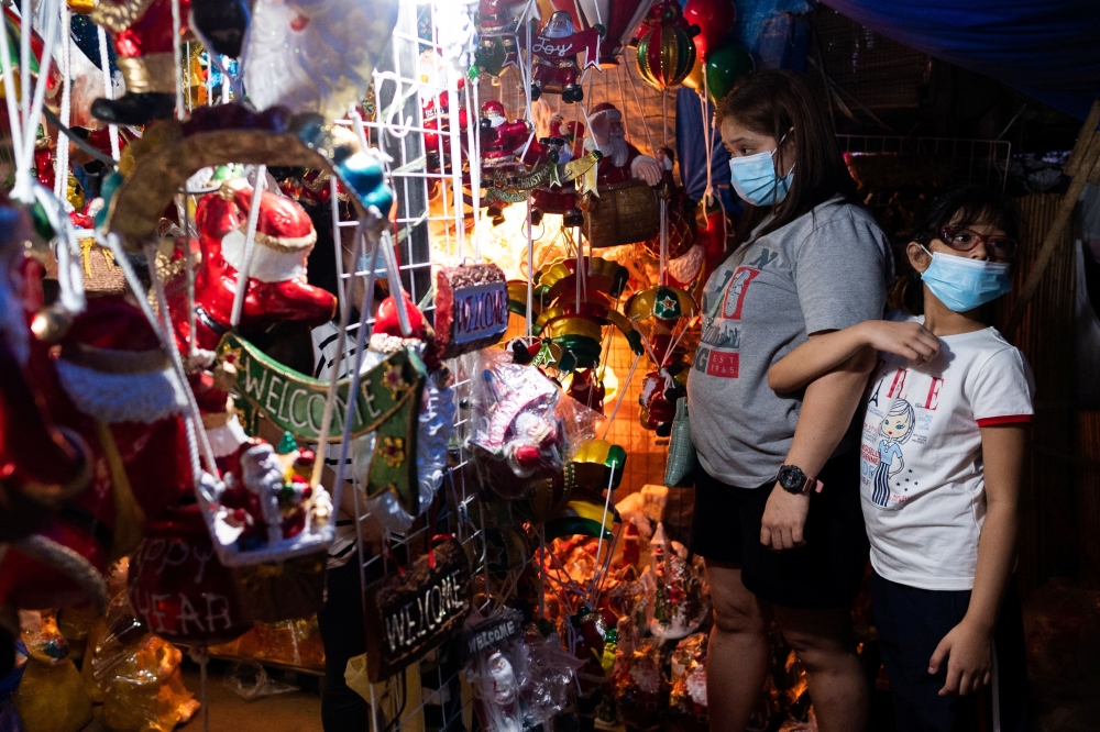 People shop for decorations at a store in Quezon City, Metro Manila, Philippines, November 14, 2021. Reuters/Lisa Marie David