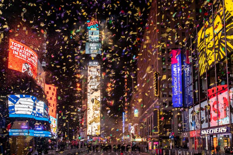 File Photo: Confetti flies around the ball and countdown clock in Times Square during the virtual New Year's Eve event in Manhattan, New York, January 1, 2021. REUTERS/Jeenah Moon

