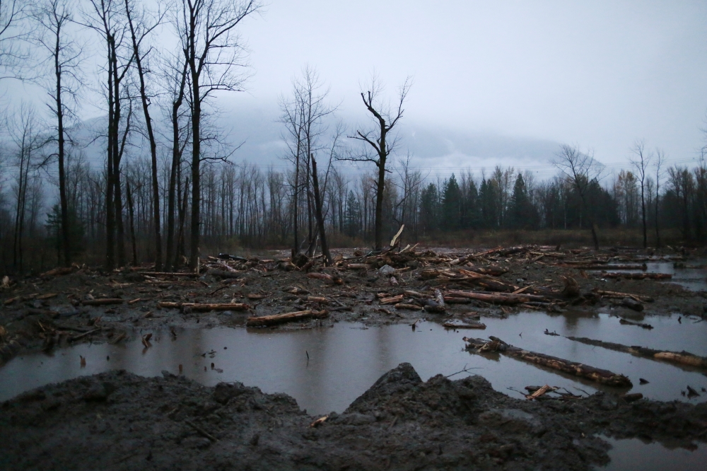 Floodwater and debris are seen at the site of a landslide on Highway 7 near Hope, after rainstorms caused flooding and landslides across British Columbia, Canada November 18, 2021. REUTERS/Jesse Winter