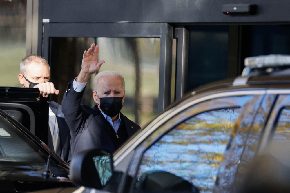 U.S. President Joe Biden waves to reporters as he arrives for his annual physical at Walter Reed National Military Medical Center in Bethesda, Maryland, U.S., U.S. November 19, 2021. REUTERS/Jonathan Ernst