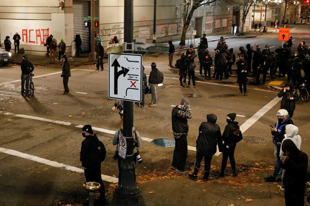 Protesters gather outside the Justice Center after the full acquittal verdict of teenager Kyle Rittenhouse in his Wisconsin fatal shootings trial, in Portland, Oregon, U.S. November 19, 2021. Reuters/John Rudoff 