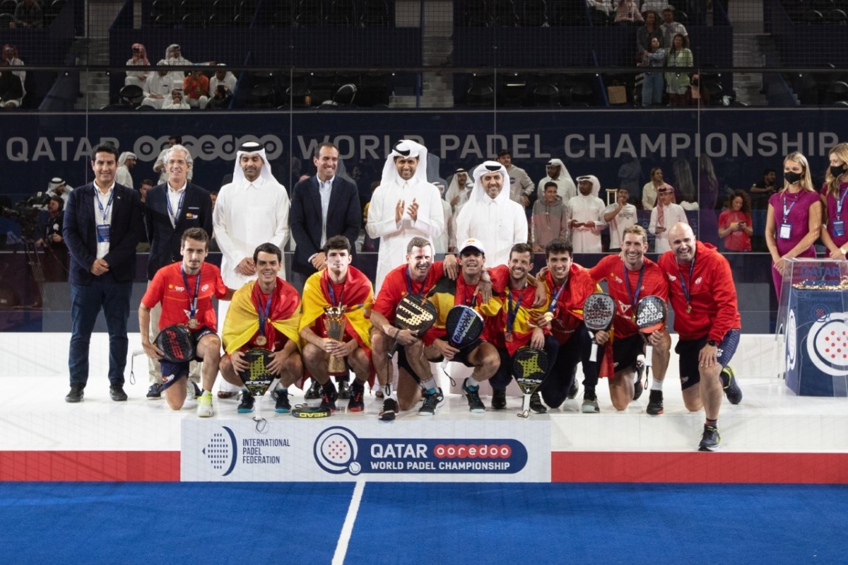 President of the Qatar Tennis Squash and Badminton Federation (QTSBF) Nasser Al Khelaifi, QTSBF Secretary-General Tariq Zainal and other officials pose for a picture with Spain's men team