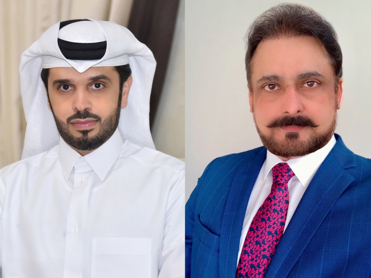 Head of the Business Development and Alternative Channels Sector at QIIB, Omar Abdulaziz Al Meer (left) and Visa’s Country Manager for Qatar, Dr. Sudheer Nair 