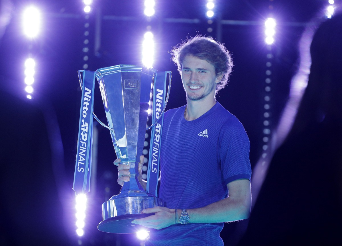 Germany's Alexander Zverev celebrates with trophy after winning his final match against Russia's Daniil Medvedev REUTERS/Guglielmo Mangiapane
