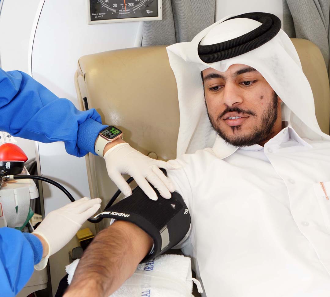A student donating blood at Qatar University. 