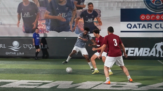 Action during the group stage of the Paris Saint-Germain - Ooredoo 5-a-side football tournament.