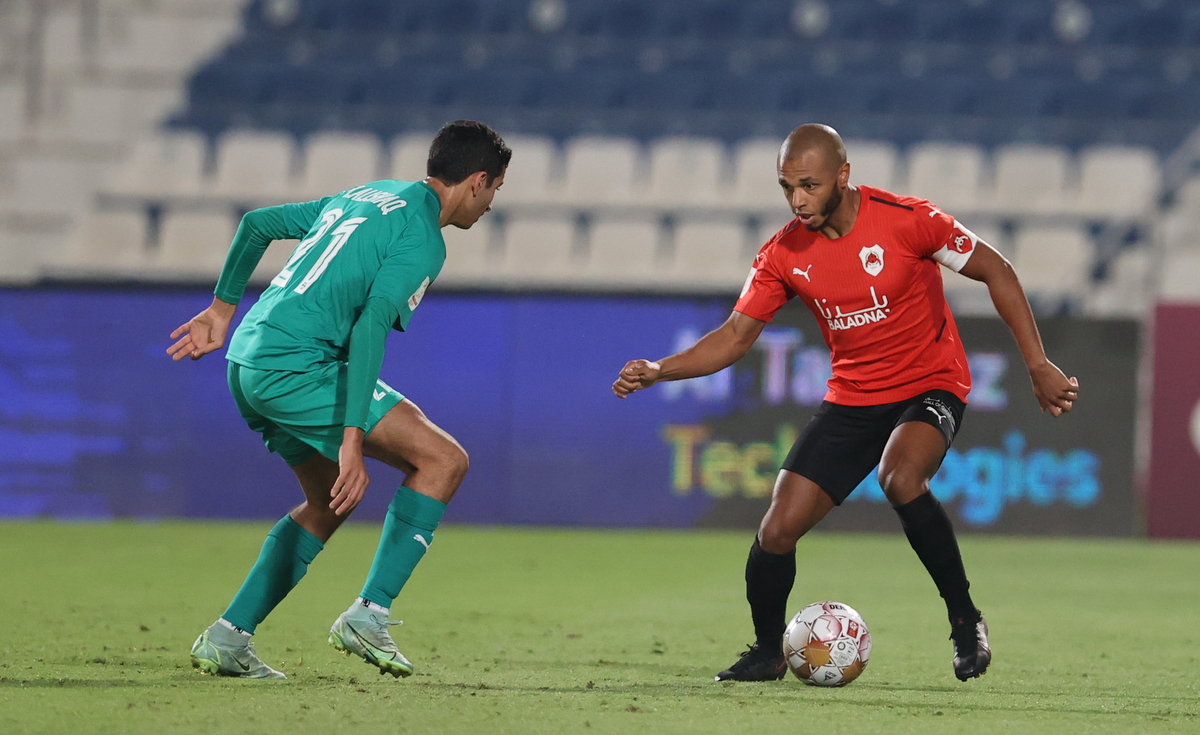 Al Rayyan’s Yacine Brahimi (right) in action during the Ooredoo Cup match against Al Ahli, yesterday.