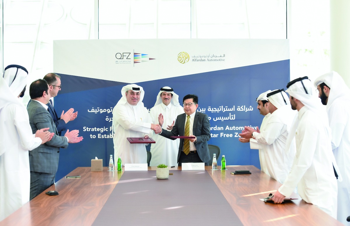 Minister of State and Chairman of QFZA H E Ahmad Al Sayed, President and CEO of Alfardan Group Omar Hussain Alfardan, CEO of QFZA Lim Meng Hui, and several senior officials from QFZA and Alfardan Automotive, during the agreement signing ceremony, recently.  