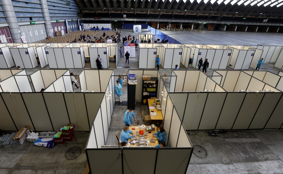 Medical workers prepare doses of the 