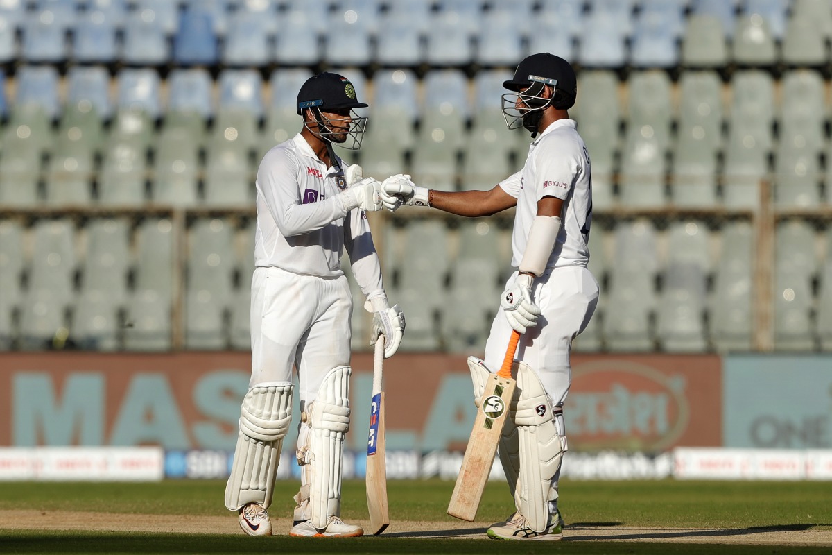 Mayank Agarwal and Cheteshwar Pujara after completing their half-century partnership