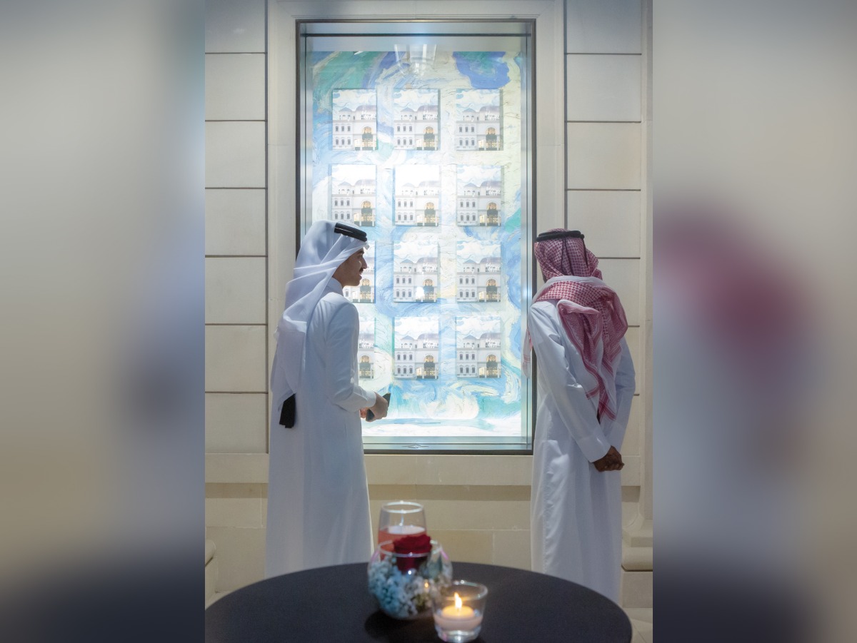 Qatari artists Fahad Al Maadheed and Nasser Alkubaisi, look at the specially dressed window at Galeries Lafayette Doha, recently.  