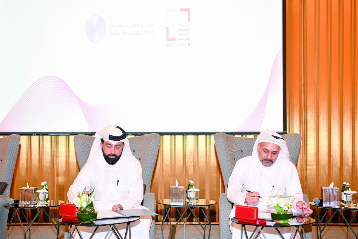 QRDI Council's Secretary-General Eng. Omar Ali Al Ansari and QFC's CEO Yousuf Mohamed Al Jaidah signing the Mou during the 'QFC meets' event at the St. Regis Hotel, in Doha, recently.  