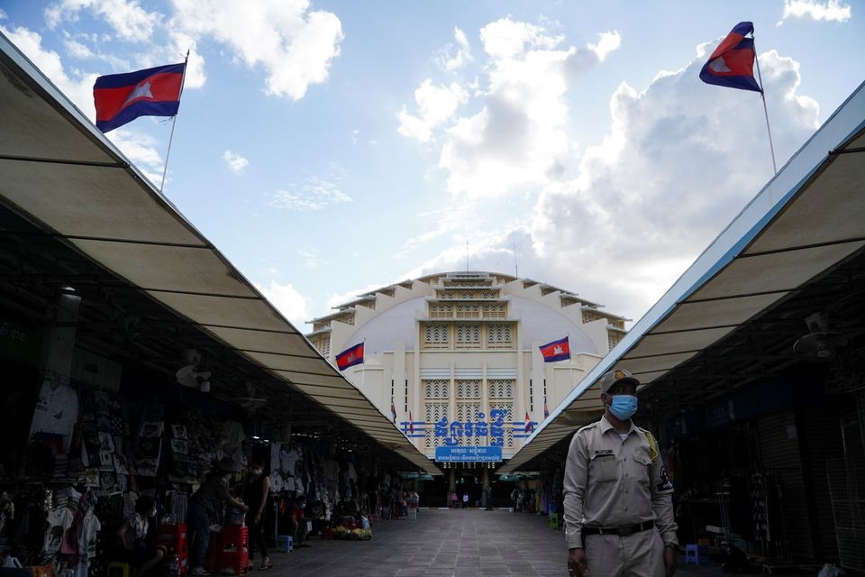 A guard walks past empty stalls at Central Market, during the coronavirus disease (COVID-19) outbreak, in Phnom Penh, Cambodia, August 12, 2021. REUTERS/Cindy Liu

